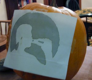 Affix the template to the pumpkin